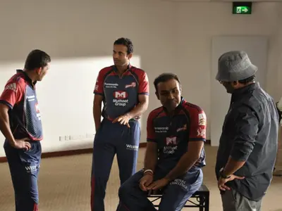 Bappaditya Roy directing Indian cricketers during a Muthoot Finance commercial
